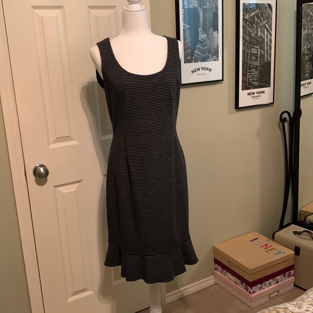 Gorgeous black designer dress. 2nd photo shows adorable but slight ruffles.